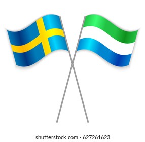 Swedish and Sierra Leonean crossed flags. Sweden combined with Sierra Leone isolated on white. Language learning, international business or travel concept.