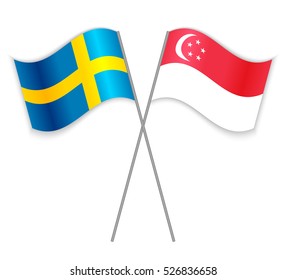 Swedish and Singapore crossed flags. Sweden combined with Singapore isolated on white. Language learning, international business or travel concept.