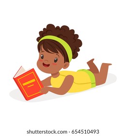 Sweet african girl lying on the floor and reading a book, colorful cartoon character vector Illustration