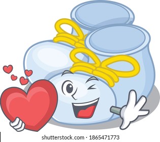 A sweet baby boy boots cartoon character style holding a big heart