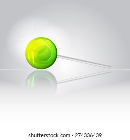 Sweet bright shiny lollipop candy on a smooth mirror surface with reflection 