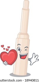 A sweet concealer stick cartoon character style holding a big heart