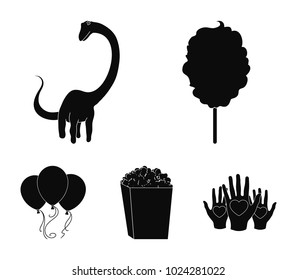 Sweet cotton wool on a stick, a toy dragon, popcorn in a box, colorful balloons on a string. Amusement park set collection icons in black style vector symbol stock illustration web.