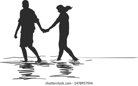 The sweet couple are walking together on a watery sea sand on the beach holding hands.