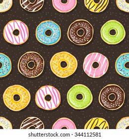Sweet donuts on the dark background. Beautiful and tasty seamless pattern.
