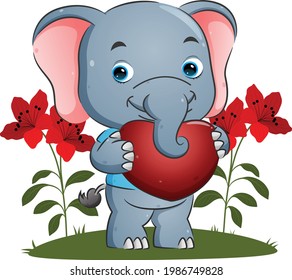 The sweet elephant is holding a big heart with the happy face for valentine of the illustration