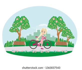 sweet girl on a bike in the park