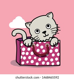 Sweet grey cat in a pink polka dot pattern paper bag on pink background
