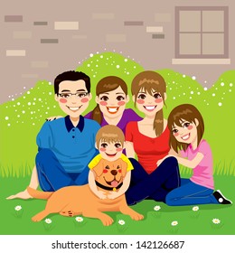 Sweet happy family posing together sitting in the backyard with their golden retriever dog