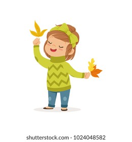 Sweet little girl in in a green sweater holding colorful maple leaves, cute kid enjoying fall, autumn kids activity vector Illustration