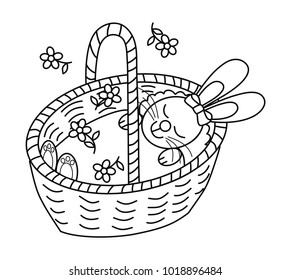 Sweet sleeping rabbit in a basket. Black and white