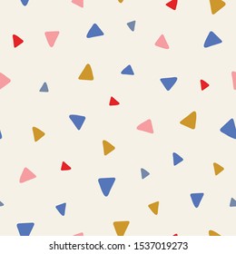 Sweet vector seamless repeat pattern of tossed hand drawn triangles in pink, red, blue and yellow. A fun random repeat design background.