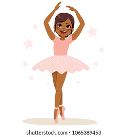 Sweet young African American teenager girl ballerina wearing pink tutu and dancing