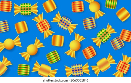 Sweets in golden wrappers. Gold foiled candies background. Top view of candies on blue background