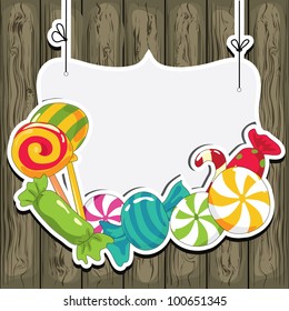 Sweets on strings on the wooden background. Vector illustration.