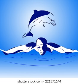 Swimmer and dolphin in the open sea