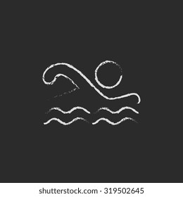 Swimmer hand drawn in chalk on a blackboard vector white icon isolated on a black background.