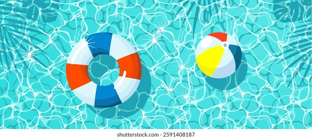 A swimming circle and a ball on the exciting surface of the water with sun glare. A pattern of a shaky water surface with a reflection of palm leaves and a floating inflatable circle and a beach ball.