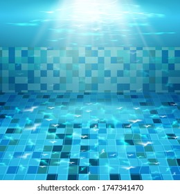 Swimming pool with blue water, ripples and highlights. Texture of water surface and tiled bottom. Overhead view. Summer background.
