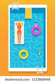 Swimming pool with clear water, inflatable circles and a girl on an inflatable beach mattress.