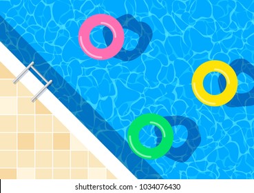 swimming pool with floating rings top view