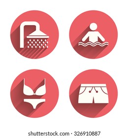 Swimming pool icons. Shower water drops and swimwear symbols. Human stands in sea waves sign. Trunks and women underwear. Pink circles flat buttons with shadow. Vector