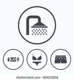 Swimming pool icons. Shower water drops and swimwear symbols. WC Toilet sign. Trunks and women underwear. Icons in circles.