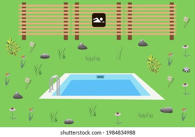 swimming pool surrounded by grass and plants on the background of a wooden fence 