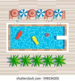 swimming pool top view with umbrellas palm trees loungers