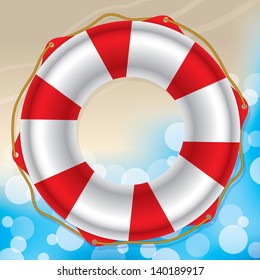 Swimming ring where sandy beach meets water