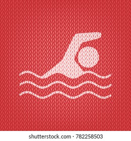 Swimming water sport sign. Vector. Knitted white icon on a red knitted background.
