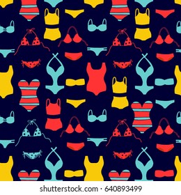 Swimsuit seamless pattern. Colorful bikini, tankini and monokini swimsuits on dark blue background