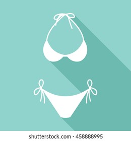 Swimsuit vector icon with long shadow. White illustration isolated on green background for graphic and web design.