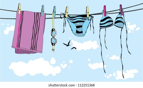 Swimwear hanging on a clothesline.