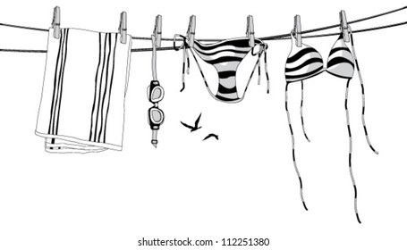 Swimwear hanging on a clothesline.