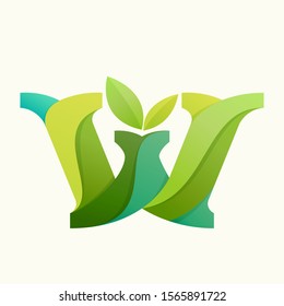 Swirling letter W logo with green leaves. Slab serif font can be used for eco, vegan, bio, raw, organic template.