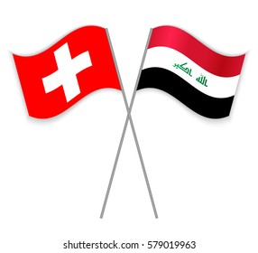 Swiss and Iraqi crossed flags. Switzerland combined with Iraq isolated on white. Language learning, international business or travel concept.