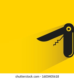 swiss knife with drop shadow on yellow background
