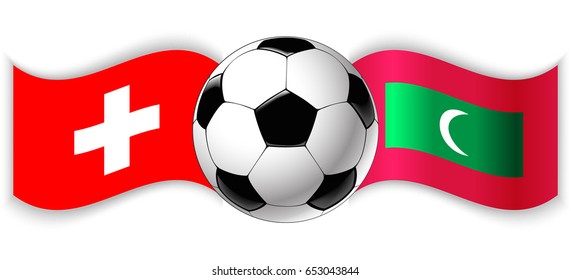 Swiss and Maldivian wavy flags with football ball. Switzerland combined with Maldives isolated on white. Football match or international sport competition concept.