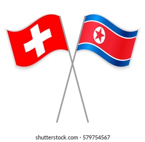Swiss and North Korean crossed flags. Switzerland combined with North Korea isolated on white. Language learning, international business or travel concept.