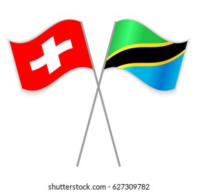Swiss and Tanzanian crossed flags. Switzerland combined with Tanzania isolated on white. Language learning, international business or travel concept.