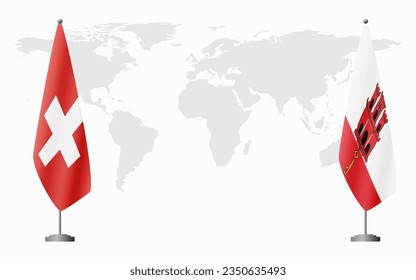 Switzerland and Gibraltar flags for official meeting against background of world map.