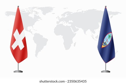 Switzerland and Guam flags for official meeting against background of world map.