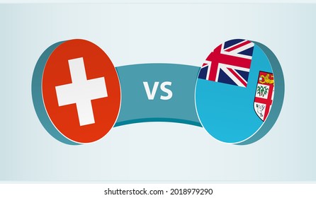 Switzerland versus Fiji, team sports competition concept. Round flag of countries.