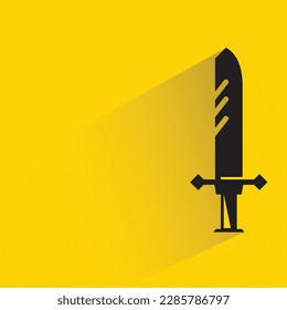 sword with shadow on yellow background