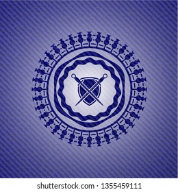 swords crossed with shield icon with denim texture