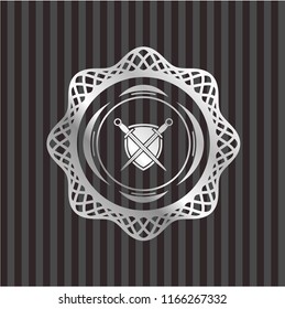 swords crossed with shield icon inside silvery badge or emblem