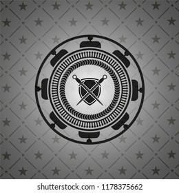 swords crossed with shield icon inside dark emblem