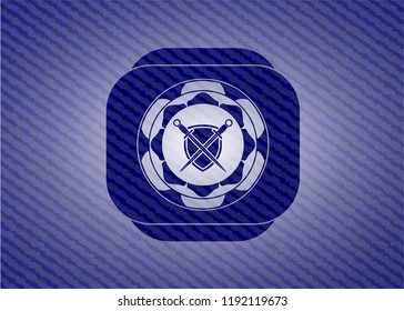 swords crossed with shield icon inside badge with denim texture