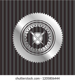 swords crossed with shield icon inside silvery emblem or badge